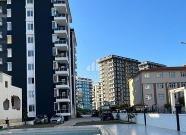 Unfurnished one bedroom apartment 50 m², in a new building with facilities, 300 meters from the sea, in the center of Mahmutlar, Alanya ID-15761 фото-1