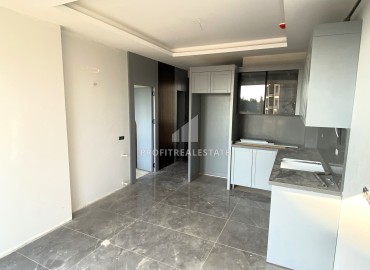 One-bedroom apartment, 60m², in a residence with facilities in the final stage of construction in Teje, Mersin ID-15769 фото-5