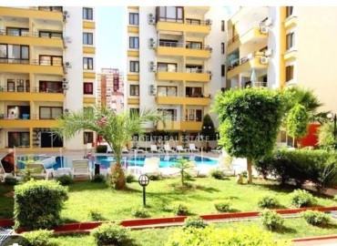 Inexpensive resale property: apartment 1+1, 60m², 250m from the sea with furniture and appliances in Mahmutlar, Alanya ID-15772 фото-1