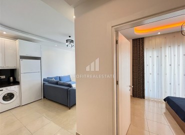 Stylish, cozy one bedroom apartment with furniture, 55 m², 450 meters from the sea, in a residence with facilities, Mahmutlar, Alanya ID-15774 фото-4