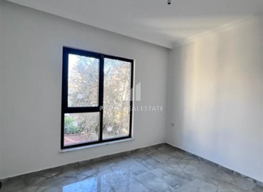 One bedroom apartment at an attractive price, in a new building, unfurnished, 50m², 550 meters from the sea, Mahmutlar, Alanya ID-15781 фото-5