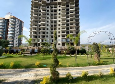 Комфортабельные квартиры, 65-110м², в элитном комплексе у моря на этапе строительства в Аяш, Эрдемли ID-15802 фото-1