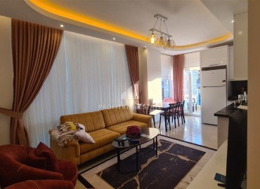 Cozy furnished one-bedroom apartment 55m², 450 meters from the sea, in a residence with facilities, Mahmutlar, Alanya ID-15810 фото-2