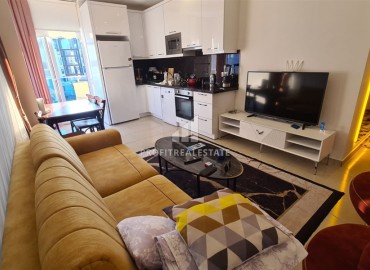 Cozy furnished one-bedroom apartment 55m², 450 meters from the sea, in a residence with facilities, Mahmutlar, Alanya ID-15810 фото-3