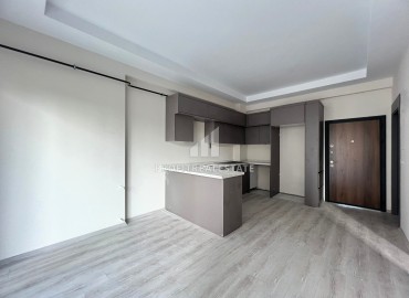 Симпатичная квартира 1+1, 55м², в комфортабельном комплексе с обширной инфраструктурой в районе Томюк, Мерсин ID-15828 фото-2