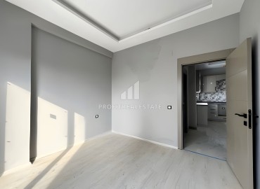 Двухкомнатные апартаменты, 65м², в новом комплексе с инфраструктурой в 300м от моря в Эрдемли, Арпачбахшиш ID-15830 фото-10