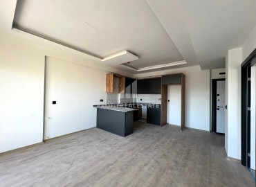 Апартаменты с чистовой отделкой по очень приятной стоимости в 500 метрах от моря в одном из популярных районов Мерсина. ID-15831 фото-2