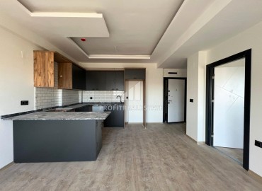 Апартаменты с чистовой отделкой по очень приятной стоимости в 500 метрах от моря в одном из популярных районов Мерсина. ID-15831 фото-3