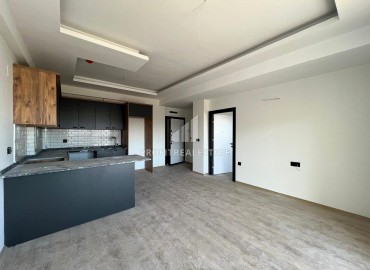 Апартаменты с чистовой отделкой по очень приятной стоимости в 500 метрах от моря в одном из популярных районов Мерсина. ID-15831 фото-4