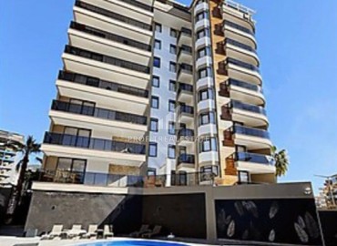 Stylish modern one-bedroom apartment 50m², by the sea, in a new residence with facilities in the center of Alanya ID-15834 фото-1