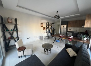 Stylish one bedroom apartment, 55 m², in a new building with an excellent location in the Alanya area - Mahmutlar ID-15837 фото-1