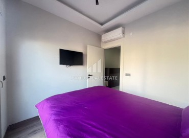 Stylish one bedroom apartment, 55 m², in a new building with an excellent location in the Alanya area - Mahmutlar ID-15837 фото-9