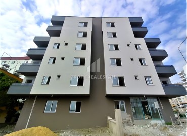 New one bedroom apartment, 50 m², in an urban house in Erdemli at an attractive price ID-15880 фото-1