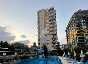 Bargain! Inexpensive two bedroom apartment with furniture, in a residence with facilities by the sea, Mahmutlar, Alanya ID-15887 фото-1