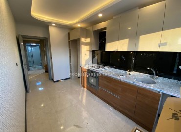 Inexpensive one bedroom apartment in a new building, with a separate kitchen, unfurnished, 55m², Kepez, Antalya ID-15920 фото-5