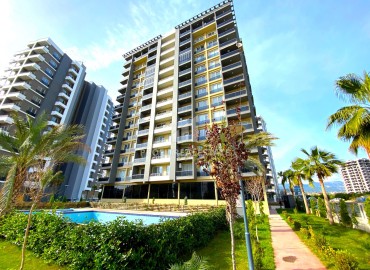 New one bedroom apartment, 55m², in a premium residence in Tomyuk area, Mersin ID-15969 фото-1