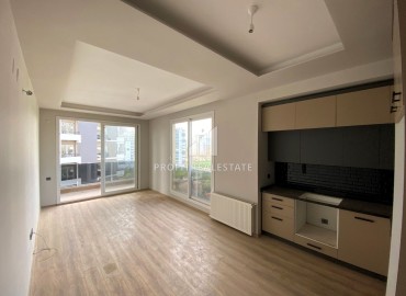 Новая квартира с одной спальней, 55м², в комплексе премиум класса в районе Томюк, Мерсин ID-15969 фото-3