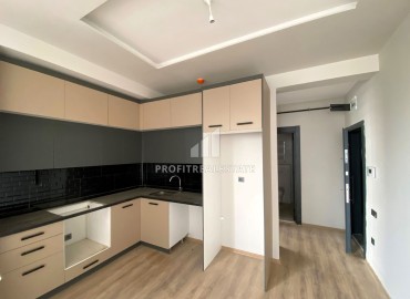 Новая квартира с одной спальней, 55м², в комплексе премиум класса в районе Томюк, Мерсин ID-15969 фото-6