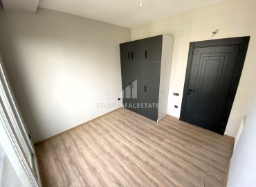 Новая квартира с одной спальней, 55м², в комплексе премиум класса в районе Томюк, Мерсин ID-15969 фото-9
