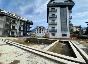 One-bedroom apartment, 60m², in a residence with good facilities under construction in Oba, Alanya ID-16018 фото-12