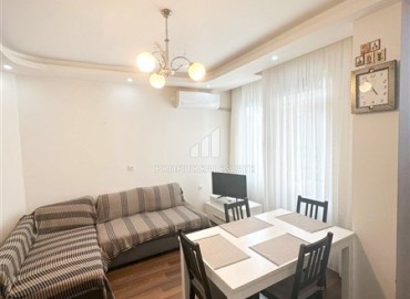 Inexpensive furnished one bedroom apartment 55m², in an urban house, 300 meters from the sea, Mahmutlar, Alanya ID-16045 фото-3