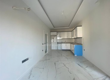 Новая квартира с двумя спальнями, 85м², в новостройке с бассейном, в 400м от моря в районе Тосмур, Алания ID-16076 фото-2