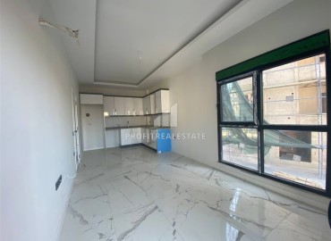 Новая квартира с двумя спальнями, 85м², в новостройке с бассейном, в 400м от моря в районе Тосмур, Алания ID-16076 фото-3
