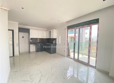 Inexpensive one bedroom apartment in a new building, unfurnished, with fine finishing and a built-in kitchen, Oba, Alanya ID-16089 фото-2