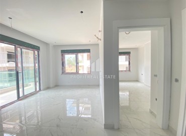 Inexpensive one bedroom apartment in a new building, unfurnished, with fine finishing and a built-in kitchen, Oba, Alanya ID-16089 фото-5