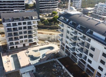 Апартаменты 1+1, 55м², в премиум-комплексе на окончательном этапе строительства, в 100м от моря в районе Каргыджак, Алания ID-16109 фото-3