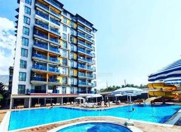 Bright furnished apartment 1+1, 45m², in a residence with extensive facilities, in the very center of Alanya ID-16121 фото-1