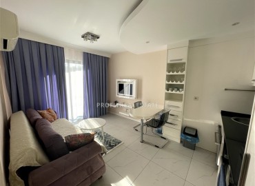 Bright furnished apartment 1+1, 45m², in a residence with extensive facilities, in the very center of Alanya ID-16121 фото-2
