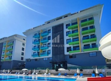 Elegant furnished 1+1 apartment, 100 meters from the sea, in a residence with rich facilities, Kargicak, Alanya ID-15130 фото-1
