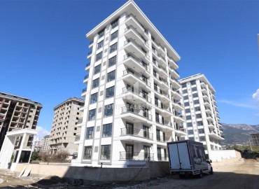 Great offer! Inexpensive new bright apartment 1+1, 55m², in a residence with facilities, Mahmutlar, Alanya ID-16204 фото-1