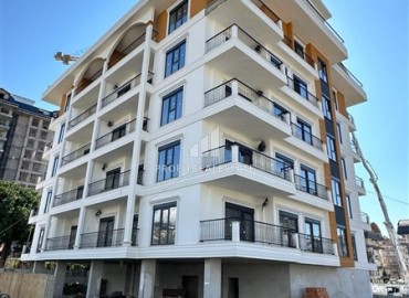 Новая квартира с двумя спальнями, 90м². в комплексе на этапе строительства в районе Махмутлар, Алания ID-16234 фото-1