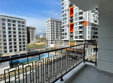 New 1+1 apartment at an attractive price, unfurnished, in a modern residence with facilities, Mahmutlar, Alanya ID-16237 фото-8