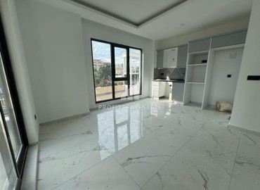 Inexpensive one bedroom apartment without furniture 50m², in a new building with facilities, Mahmutlar, Alanya ID-16241 фото-5