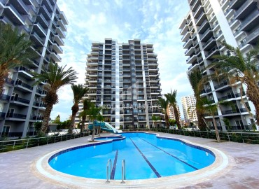 One-bedroom apartment, 60m², in a new premium residence, 380 meters from the sea in Teje, Mersin ID-16261 фото-1