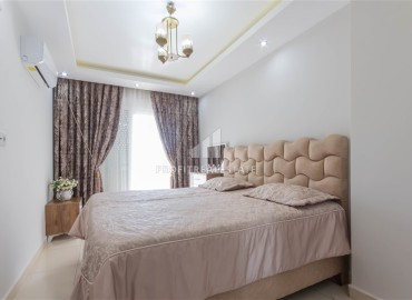Уютная квартира с двумя спальнями и дизайнерским интерьером, 110м² в 350м от моря в Махмутларе, Алания ID-16269 фото-11