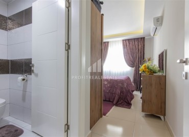 Уютная квартира с двумя спальнями и дизайнерским интерьером, 110м² в 350м от моря в Махмутларе, Алания ID-16269 фото-14