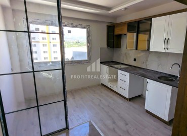 Новая трехкомнатная квартира с отдельной кухней, 110м², в районе Томюк, Эрдемли, в 550м от Средиземного моря ID-16285 фото-3