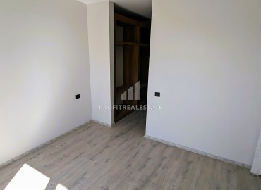 Новая трехкомнатная квартира с отдельной кухней, 110м², в районе Томюк, Эрдемли, в 550м от Средиземного моря ID-16285 фото-11