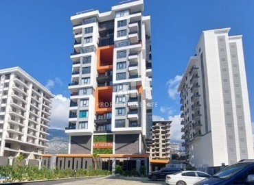 New unfurnished apartment 1+1, with a stylish kitchen unit in a new building with facilities, Mahmutlar, Alanya ID-16293 фото-1