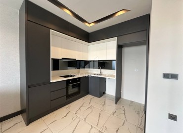 Новая квартира без мебели 1+1, со стильным кухонным гарнитуром в новостройке с инфраструктурой, Махмутлар, Аланья ID-16293 фото-4