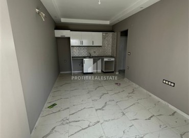 Inexpensive one bedroom furnished apartment, with fine finishing in a new residential residence, Mahmutlar, Alanya ID-16294 фото-3