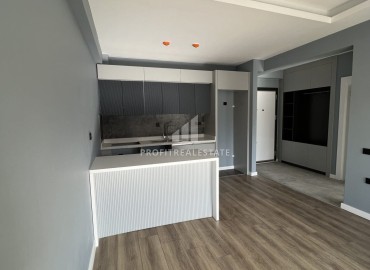Срочная продажа: новая квартира с одной спальней, 65м², в элитном комплексе в Арпачбахшиш, Эрдемли ID-16323 фото-2
