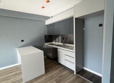 Срочная продажа: новая квартира с одной спальней, 65м², в элитном комплексе в Арпачбахшиш, Эрдемли ID-16323 фото-3