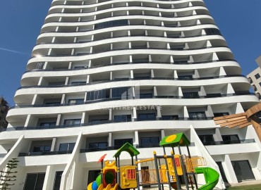 Срочная продажа: новая квартира с одной спальней, 65м², в элитном комплексе в Арпачбахшиш, Эрдемли ID-16323 фото-20