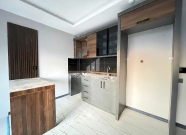 Квартира с одной спальней, 50м², в новом комплексе с бассейном в районе Томюк, Мерсин по супер цене ID-16334 фото-5