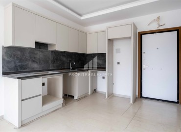 Двухкомнатная квартира 52 м², без мебели, с чистовой отделкой в современной новостройке, Махмутлар, Аланья ID-16420 фото-5